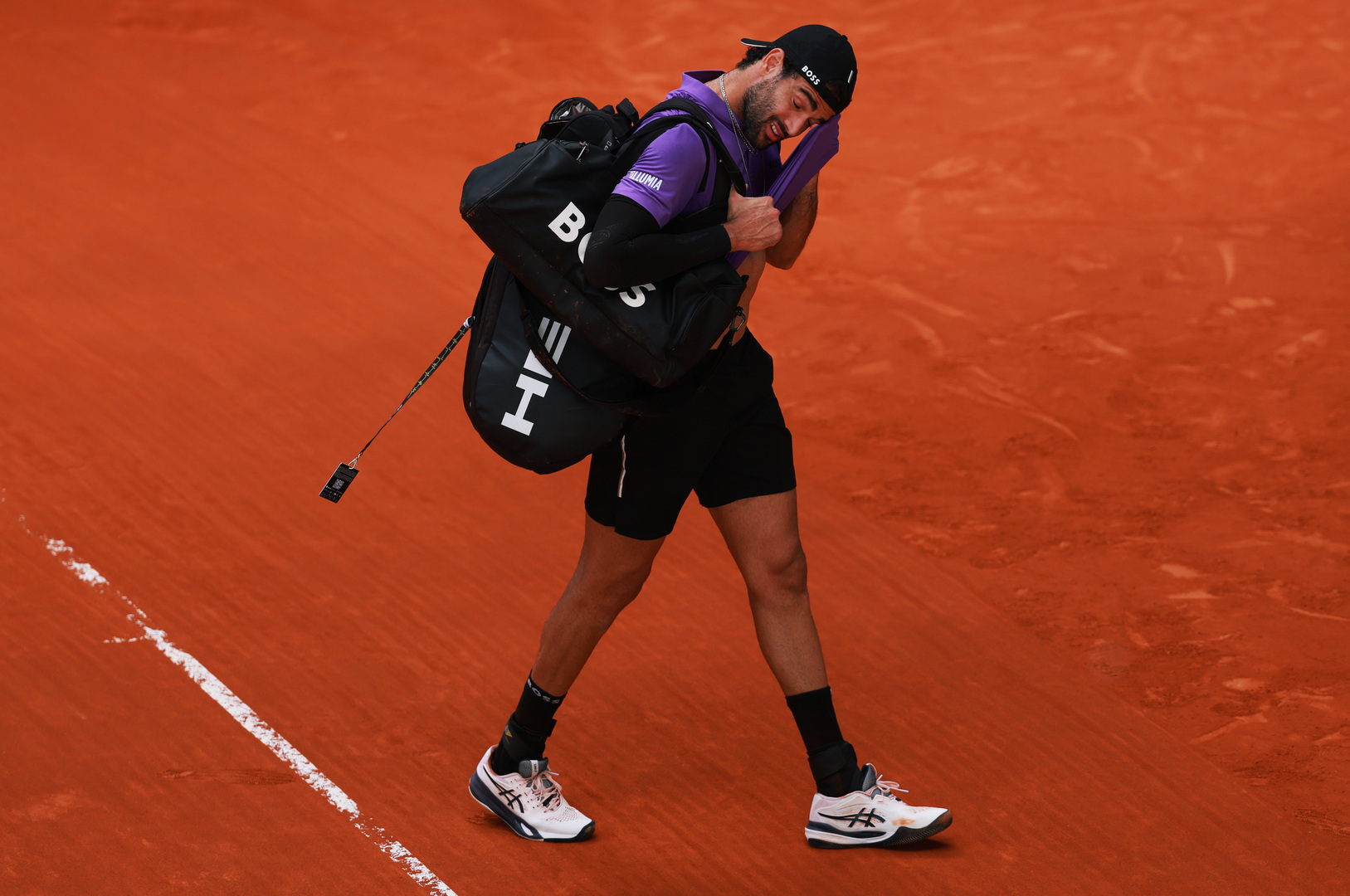 Matteo Berrettini of Italy leaving the court during a tennis match.