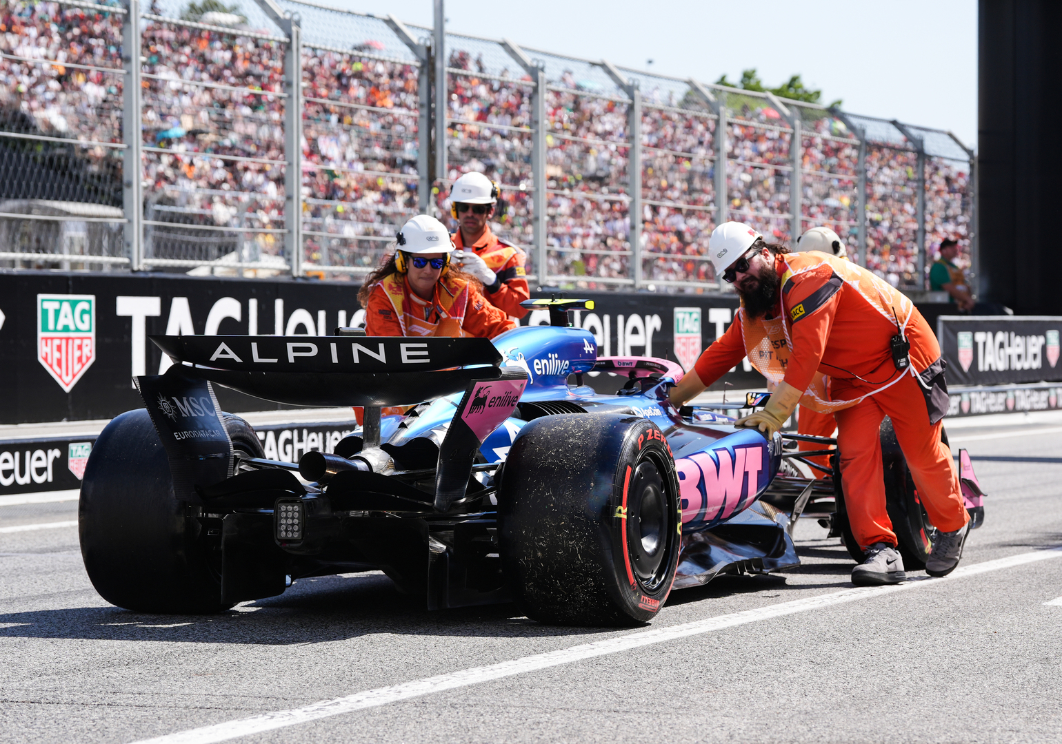Alpine's Franco Colapinto's Formula 1 car being pushed back to the pits during qualifying.