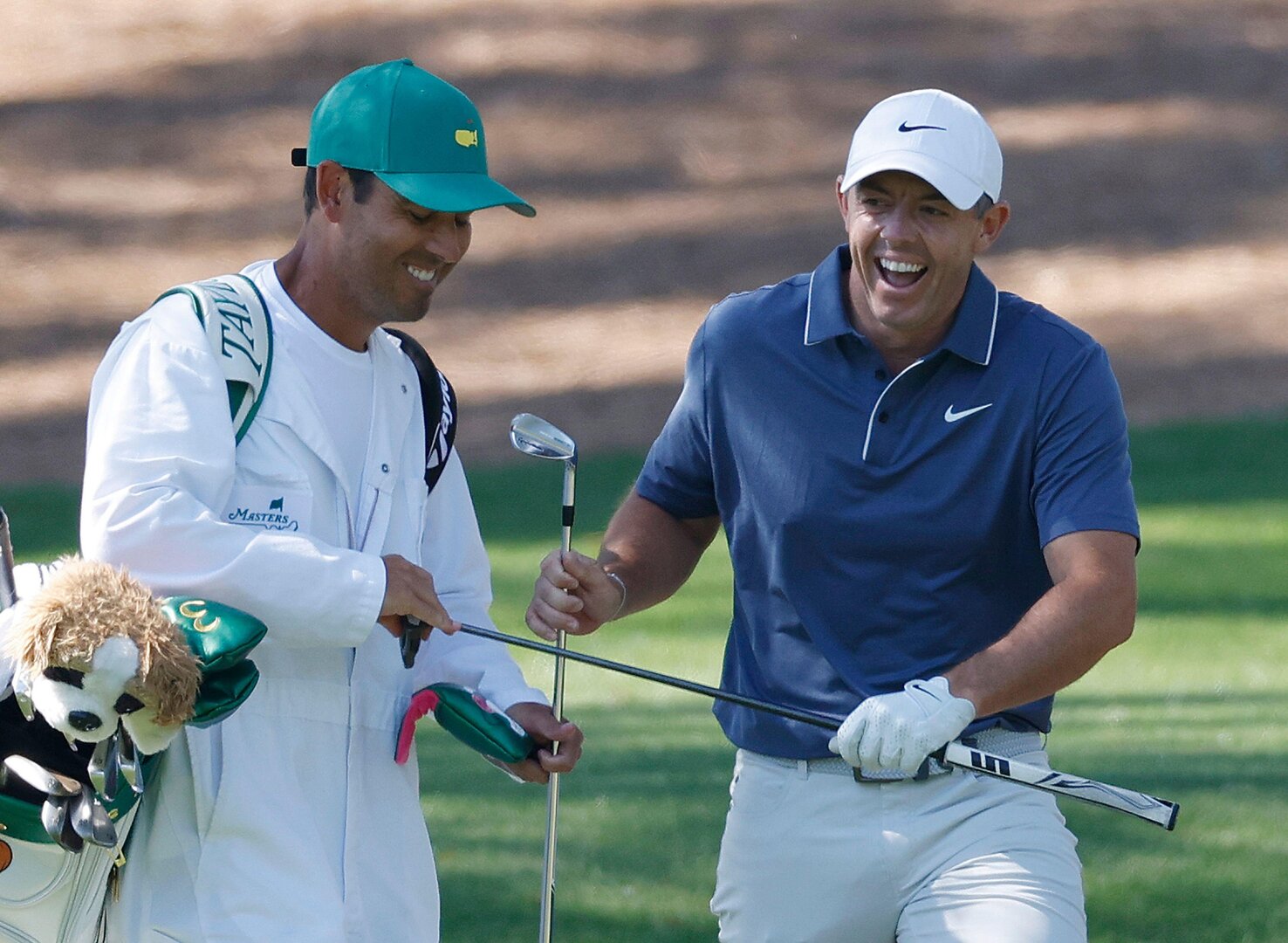 Augusta, United States. 13th Apr, 2025. Rory McIlroy of Northern Ireland laughs with his caddie Harry Diamond after hitting his approach shot to the 7th green during the final round of the 2025 Masters golf tournament at Augusta National Golf Club in.
