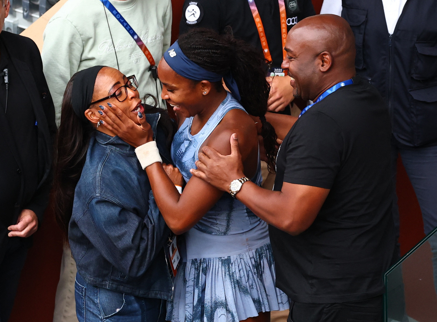 Coco Gauff celebrates winning the French Open with her parents.