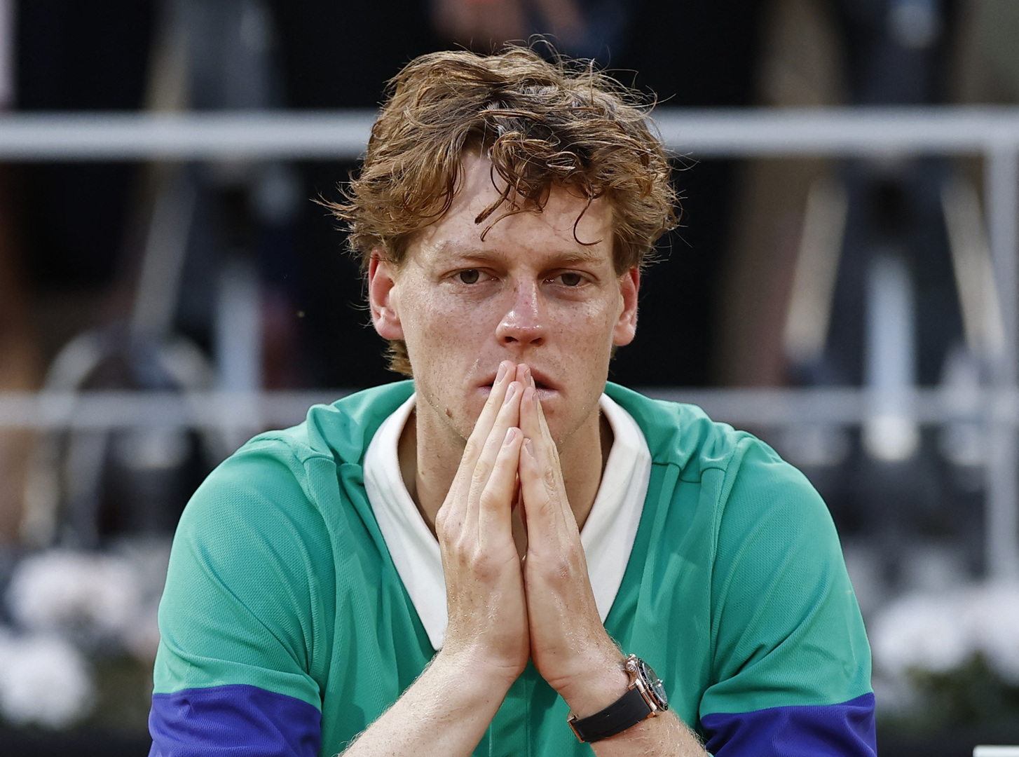 Jannik Sinner looking dejected after losing the French Open men's singles final.